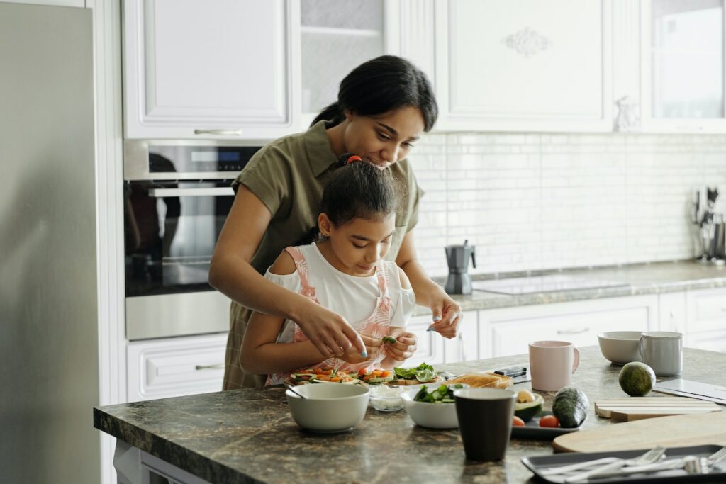 Mother and daughter cooking