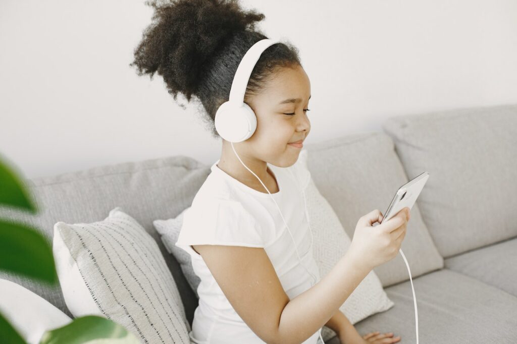 Kid listening to a podcast